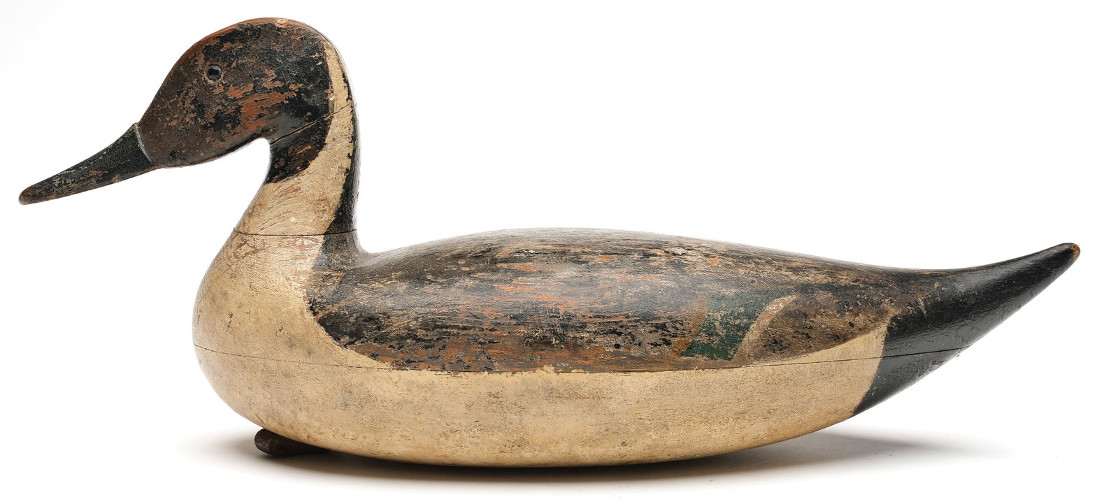 George Runyan (1875-1922), Bordentown, New Jersey.: Hollow carved pintail with upswept tail and inlayed lead weight in underside. Bob White collection ink stamp on underside. Also with the maker's name stamped in to lead weight. Measures 18" long. PROV
