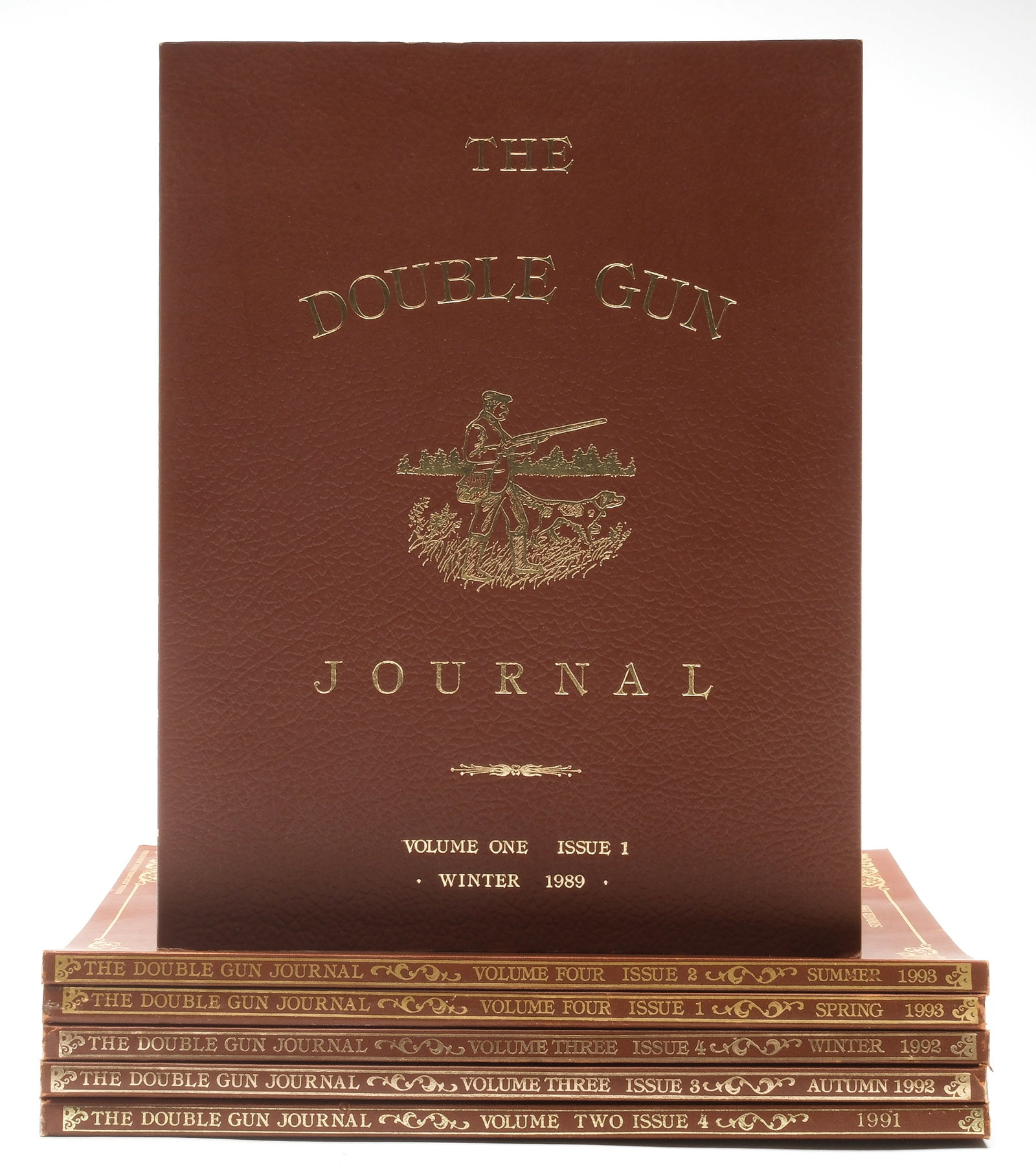 FIRST YEAR VOL.1 WITH LARGE COLLECTION OF DOUBLE GUN JOURNALS: 108 issues of The Double Gun Journal. This lot includes the first ever Double Gun Journal - First Year Vol. 1 1989. The publication is trimmed in gold leaf and printed on the best quality stock. It