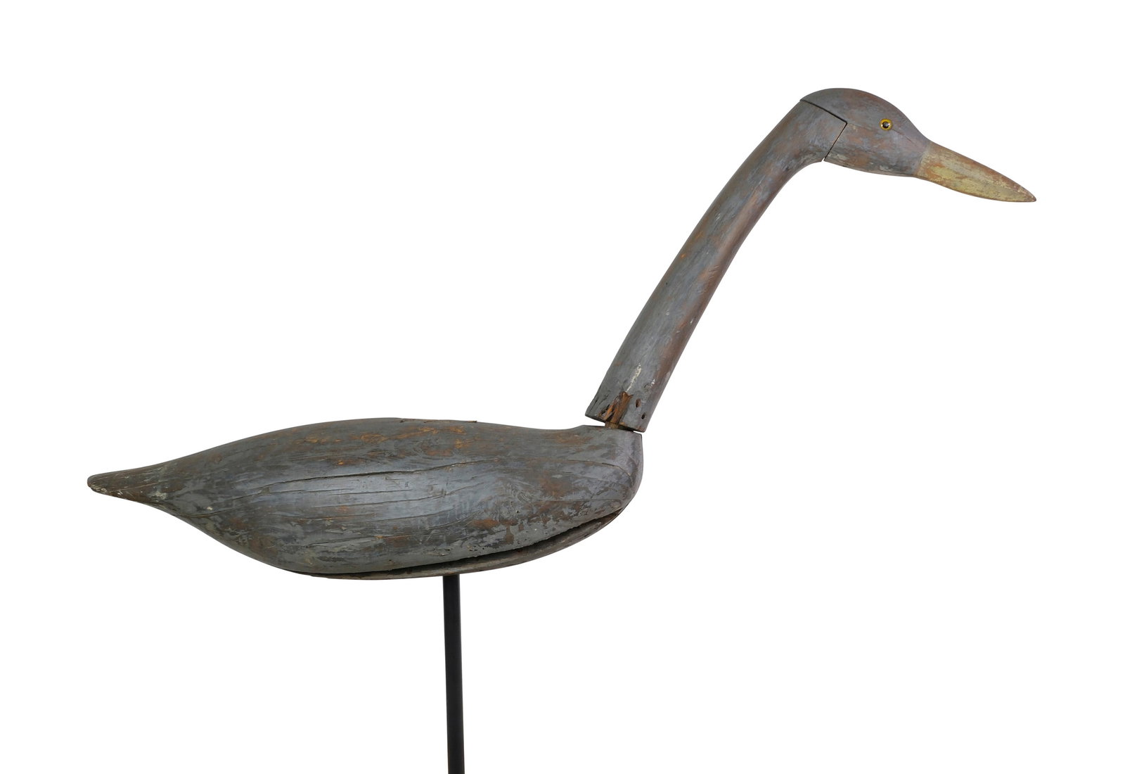Captain Al Ketchum, Long Island, New York, 2nd half 19th century.: Early and important working great blue heron decoy.Three piece construction with two piece head and neck. Glass eyes. The large body has a dowel for the lower piece of the neck to sit on. Hole is dril