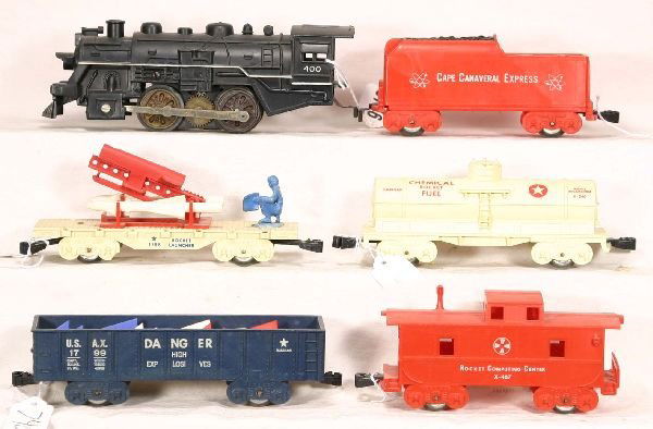 NETTE - MARX Cape Canaveral Steam Set: 400 Loco; CCE Tender; 1799 Gondola w/Missiles, blue, red & white w/insert; Rocket Fuel Tank car, cream version; 1798 Missile Launcher, complete & unbroken, tougher cream version; X-467 RCC Caboose, C8