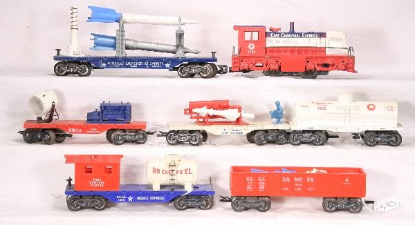 NETTE - Deluxe MARX Cape Canaveral Set: 1798 Diesel, no cracks; 1799 Ordinance Gondola w/3 missiles & original insert; 245 Rocket Fuel Tank Car; 1796 Rocket launcher, launcher part restored, but some repairs separated, 2 original missiles;