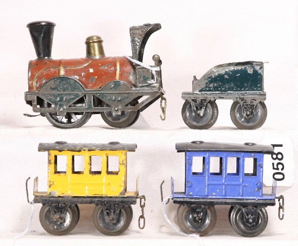 NETTE - Early French Passenger Set: O Ga., Marked FV; HP tin Clock work untested, 0-4-0 Loco; Tender; 2 Coaches, blue car has repainted roof, some flaking, but you'd flake too at 110 years old! C5 ish