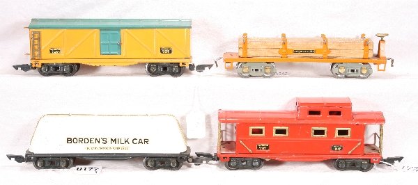 NETTE - 4 AM FLYER AM FLYER Pre O Freights:: 408 Boxcar, loose brake wheel; 412 Milk Car; 411 Caboose; 3216 Lumber Car, C6+ -7