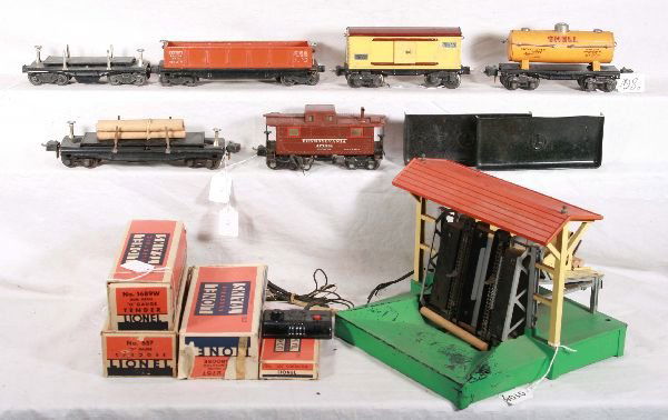 NETTE - 8 Pc. LIONEL Pre War Lot: 164 Lumber Loader, needs controller wiring, C6; 2654 Shell tank car; 3811 Lumber Dump; 2757 Caboose; 655 Boxcar, MBC; 3651 Lumber Dump, 2821 Gondola, several have postwar trucks, prewar trucks include