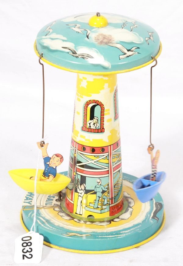 NETTE - UNIQUE ART Sail-A-Way Boat Ride: Litho Tin w/plastic boats w/litho kids, clock work working w/plink-plank-plunk music sound, small oxi spot on top, o/w C7