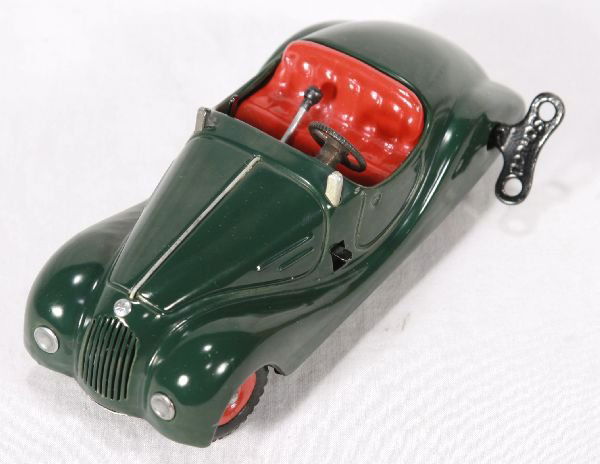 NETTE - Drk. Green SCHUCO 4001 Examico: Litho tin, clock work working w/key, missing wind screen, minor wear on bottom, o/w C7+