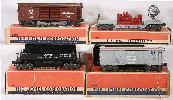 NETTE - 4 Boxed Early LIONEL Freight Cars: 3454 PRR Oper. Merchandise car, repro cubes w/bin, silver nicer than usually found; 3469 Coal Dump w/bin; 6520 Searchlight Car, RS lettering w/maroon generator; 2458 PRR Boxcar, late FS trucks, obs wo
