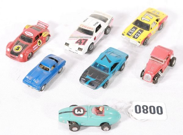 NETTE - 8 Pc. AURORA, TYCO, LIONEL Slot Cars:: Aurora T-Jet Indy Racer & Coupe Racer; AFX Firebird & Charger; Lionel Corvette; Tyco Firebird & Porsche, all appear unbroken, but sold AS-IS