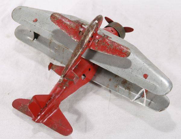 NETTE - Scarce MARX Glider Launcher Airplane: Pressed Steel Bi-Plane Tri-motor, 12" WS. Original Mini plane glider clipped on top wing, a few small oxi spots but may clean, small plane is C2, o/w C6 Rare!
