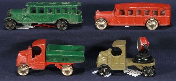 NETTE - 4 Early TOOTSIETOY Vehicles:: C-Cab Mack Coal Truck; Bus, embossed Overland Bus Line; Generic Bus; C-Cab Mack Army Searchlight Truck, light loose, o/w C7+
