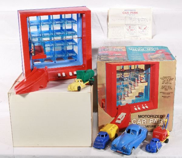 NETTE - 5 Pc. Plastic Toy Lot:: 1968 GTC Motorized Car Park, holds 16 cars, nice shape, untested Bat. Op, ob; 7: Ideal Tri-Color Mobile Shovel; 6" Ideal Tri-Color Cement Mixer;, cracked; 6" 2-color Ideal Garbage Truck; 9" Ideal Jagu