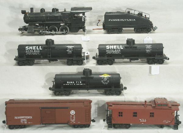 NETTE - 7 Pc. Restored LIONEL Scale Lot:: 701 B6 Switcher boiler & chassis only, boiler restored; 701T Tender, chassis modified; 2 #715 Shell Tank Cars; 714 Kramer Boxcar, 1 latch loose; 717 Caboose(2957 decals), some original trucks , some r