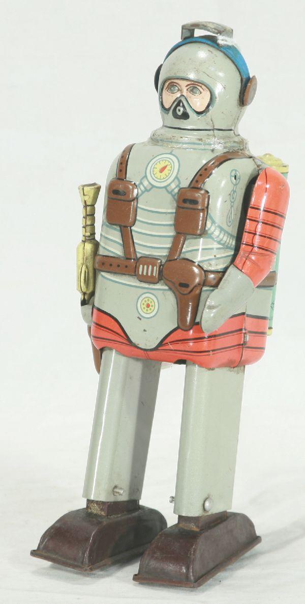NETTE - Scarce TN Japan Namora Robot:: Litho tin, wind-up working, 8" tall. Arm moves as walking, a few small oxi spots under litho in spots, but clean & shiny otherwise, has some light glue residue around neck as if he has a scarf or ribb