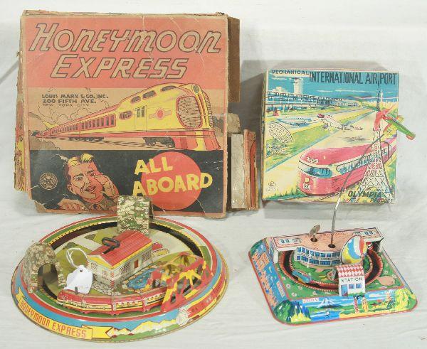 NETTE - 2 Boxed Honeymoon Express Toys: Marx M10,000 set, clean 10"W, working, w/worn ob, C9; K Japan International Airport. Nice variation with Train & Car spinning around with an airplane above and a ringing bell, 6" SQ, ob C9+