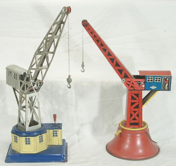 NETTE - 2 Large Tin Derrick Loaders:: Wolverine #20, crank op, move lever to rotate or lower hook, 18" T, C6; Possibly Brimtoy, made in Great Britain, 20" Crane, clock work working w/a key, lever Op, rotates 360 deg. 2 directions, raises 