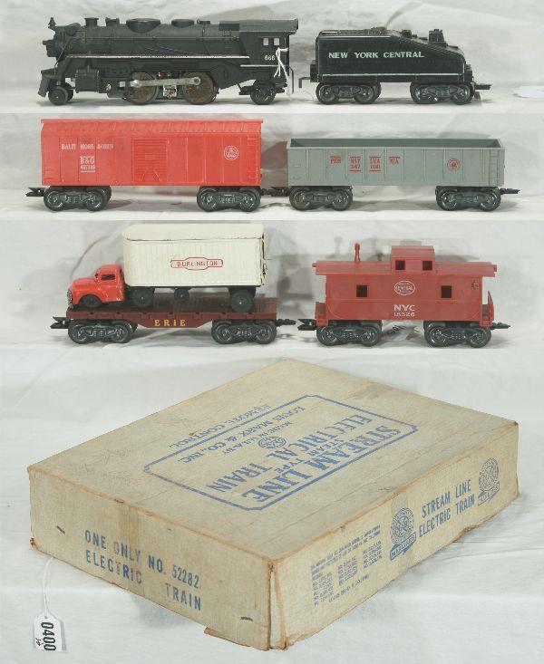NETTE - Boxed MARX Steam Freight Set 52282: 1666 Cast Loco w/smoke, Bottle included; NYC Wedge tender; B&O Boxcar; Erie Flat w/Burlington Trailer w/tractor, missing 1 door; PRR Gondola; 18326 NYC Caboose, T&T, osb w/inserts, o/w C7