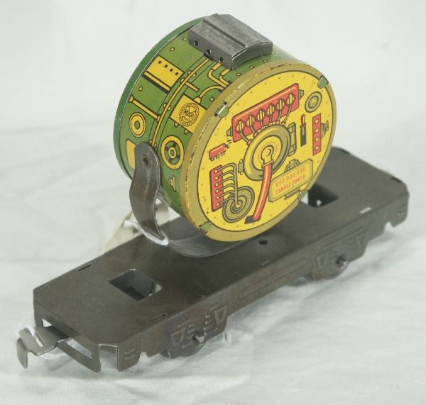 NETTE - MARX Prototype Military Searchlight:: 6" Tin khaki flat w/floor train Searchlight riveted on. Photoed in 1st Greenburg's book, page 8. Dick MacNary wasn't sure it was real and labeled it as his 1 & only buying mistake. Others disagree, yo