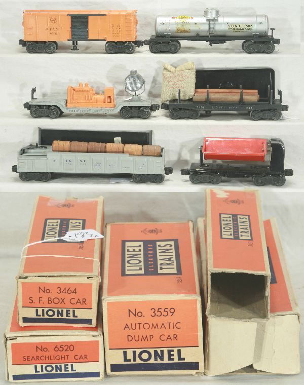 NETTE - 6 Boxed LIONEL Freight Cars: 2555 Sunoco Tank Car, bright decals are 95%; 3464 SF Oper Box; 6520 Searchlight Car; 3451 Oper. Lumber dump; 3652-25 Oper. Barrel Car, missing figure w/load & MPC bin; 3559 Ore Dump w/bin, worn obs ex