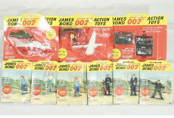 NETTE - 9 Carded AC GILBERT James Bond 007 Lot: #7 Moneypenny; #3 Bond in Scuba Outfit; 2 #9 Dominos, 1 card is damaged on top; #5 M the Boss; #4 Odd Job; Gun Case w/Bullet Shield Desk Set; Pool Table w/Figure & Laser Ray Set, laser broke off pins,