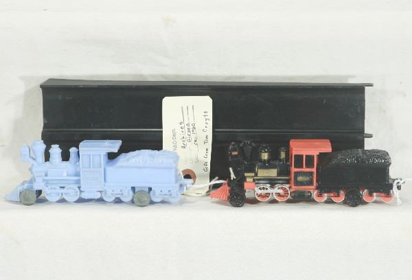 NETTE - 3 MARX Prototype Toys:: All came from the Archive sale in Girard, PA. Plastic Race Car Ramp, marked on bottom, "#3010 DUPLICATE//1-29-64//Girard, PA" ; 2 5 1/2" Plastic Trains, 1 is hand painted, other has metal wheels, tag 