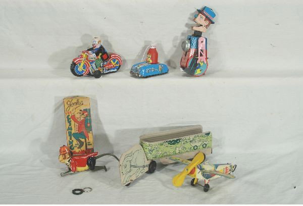 NETTE - 6 Piece Tin Toy Lot:: Marx 7" Joko Monkey, ob C9; 12" Cortland Easter Toy, faded, C5; SY Japan 7: Traveling Sam(Peace Corps) Working, C7; 3" Marxi Ketchup Car, C6; 6" Clown Motorcycle, working, C9; Possibly Unique Art Plan