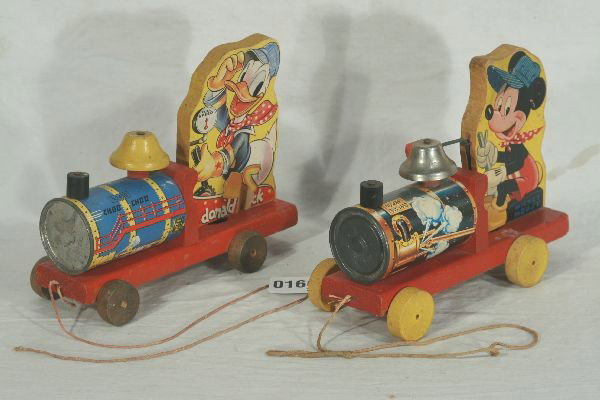 NETTE - FISHER PRICE Mickey & Donald Toy Trains: Black Labeled Pre War. 450 Donald Duck Choo-Choo, shiny boiler front, missing noise maker w/string; 1950s 485 Mickey Mouse Choo-Choo, boiler front plating worn, o/w bright & Clean o/w C7