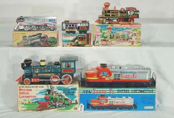 NETTE - 5 Boxed Tin Train Toys:: TM Japan, Western Loco, 15"L; bat. Op. smoke, sound 7 light, ob w/insert; 6 1/2" San Fran Friction Trolley; 10" Dayia Comet Friction train, works sometimes; TM Japan, 17" SF Diesel, bat. Op, working, 