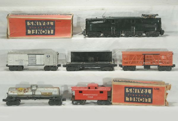 NETTE - 6Pc. LIONEL GG1 Freight Set:: 2332 PRR GG1 Electric, lettering 10%, missing 1 pantograph; 3454 Oper Merchandise Car, rough ob; 3451 lumber Dump, incomp; 3656 Stock Car only; 2555 Sunoco tank Car; 2472 PRR Caboose, worn ob, o/w Wel