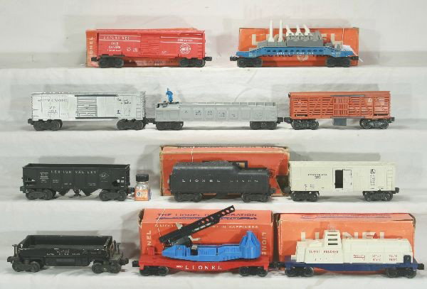 NETTE - 11Pc. LIONEL Rolling Stock Lot:: 2046W Tender, worn ob; 3469 Coal Dump; 6472 reefer, incompl.; 3656 Stock Car only; 6464-1 WP Boxcar; 3562-25 Barrel Car; 6456 LV Hopper; 6470 Target Car, incomp, ob; 6544 Launcher, brakewheels shot of
