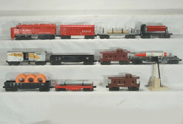 NETTE - 12 Pc. LIONEL Lot:: 1055 TS Alco A diesel; 6121 Pipe car, ob, C8; 253 Block Signal, ob w/instr, C7+; 6017 Caboose, rough ob, C7; 6062 Gondola w/reels, ob C8; 6175 Flat w/Rocket, ob worn, C7; 6462 Gondola; 3474 WP Boxcar,