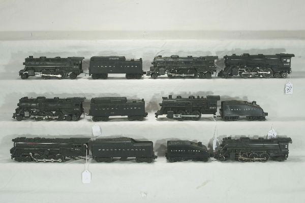 NETTE - 12Pc. LIONEL Loco & Tender Lot: 1060 Loco; 1050T tender; 2037 Loco; 6026W Tender; 1050T tender; 682 Turbine; 2046W-50 Tender; 2035 Loco; 2 #2026 Locos o/w Well played with, some chips, possibly incomplete. View photo carefully.