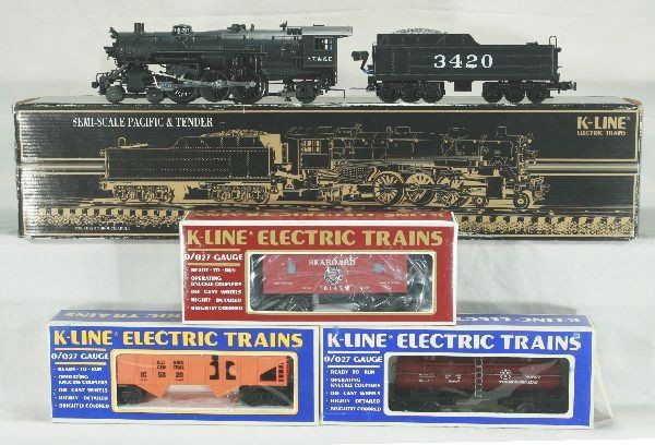 4 pc K-line Lot: K-330-3420 ATSF Pacific semi-scale die-cast steam engine and die-cast tender; K-5410 Monon tank car; K-6145 Seaboard classic caboose; K-5320 Illinois central hopper car. Ob. Has light play wear.