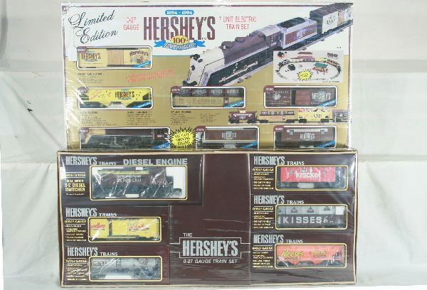 2 Hershey's sets Lot: K-1401 100th anniversary 7 unit train set die cast smoking engine; 1112 Hershey 6 unit electric train set. Dual motor S-7 diesel switcher die cast wheels. Obs. Is factory new.