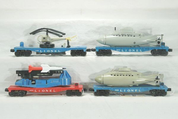 4 Lionel Space Cars: 3830 Flat with Sub, orig. sub broken and incomplete; 6650 ICBM Launcher; 6830 Flat with Repro Sub; 3419 Powder Blue Flat with Lg winder and double bladed copter, flat has 1 broken step, Has moderate p