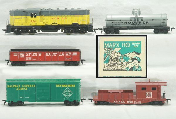 Marx boxed HO set 71553: Santa Fe GP7 diesel, hooker tank car, western MD gondola, REA box car, Santa Fe work caboose, track and transformer, osb w/ inserts, nice, Has light play wear.