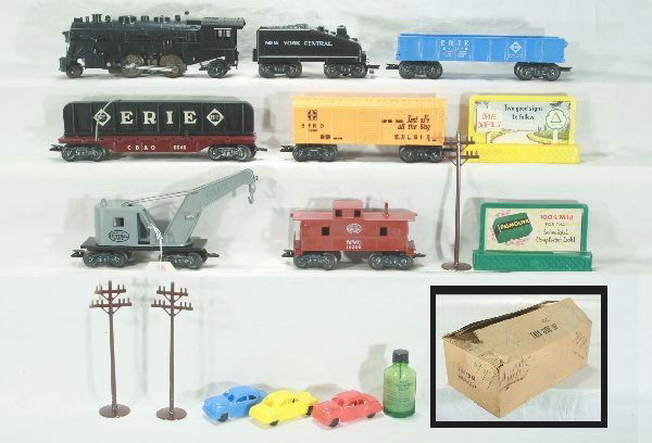 Unusual boxed Marx set for Grants #50370: 1666 steam loco w/ smoke, NYC wedge tender, orange Santa Fe box car, gondola, CB&Q flat w/girder-no hold down, NYC derrick, NYC caboose has small melt mark on copula roof, accessories incl. 2 billboar