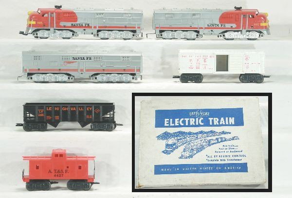 Boxed Marx Happi-Time Triple-diesel set 09615: 1095 Santa Fe E7 ABA diesels, clean matched graphics, gray mold, dairy box car, Erie gondola, Santa Fe caboose, track and transformer, osb-top has 2 split corners w/ inserts, Has light play wear.