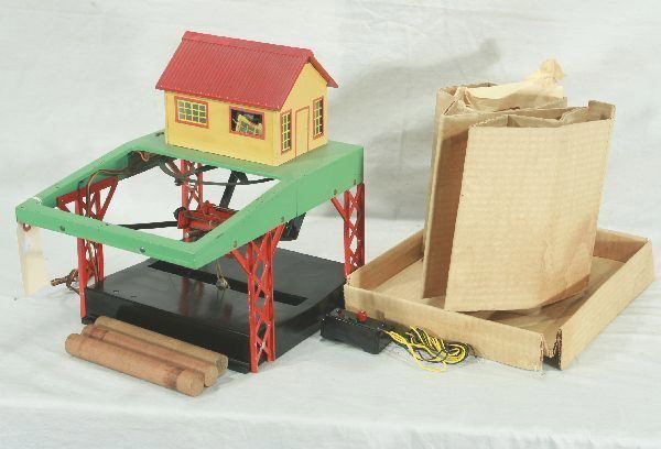 American Flyer S-gauge 751 Lumber Loader: Later black base version complete w/ 3 orig. logs and controller, window inserts, orig. roof, has 2 orig. inserts for box, Has moderate play wear.