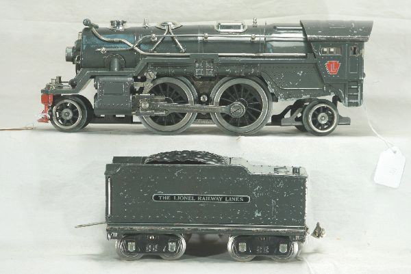 Lionel Standard Gauge 385E Loco and Tender: Cleaned and polished, nickel trim, replaced steam chest; 385W Tender, cast shell is original showing minor warping, wheels turn freely, looks ready to run. Has moderate to excessive play wear.