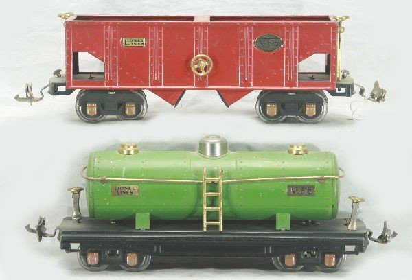 Lionel 815 and 816 Freight Cars: 815 tank car, 816 hopper, both have brass trim w/ copper journals, Has light to moderate play wear.