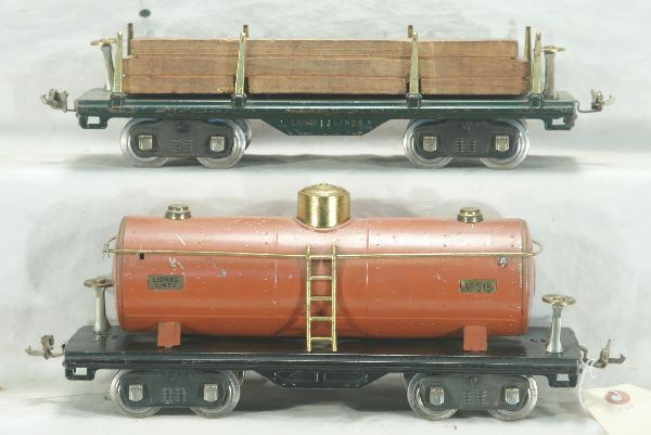 Lionel 515 and 511 S-gauge Freight Cars: 515 terra-cotta tank car-3 handrail stanchions loose, 511 lumber car-orig. load, empty box for 513 stock car-rough, Has moderate play wear.