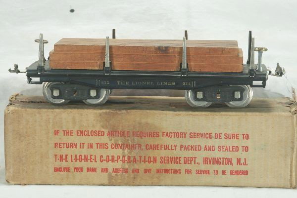 Boxed Lionel 211 Lumber Car, Standard Gauge: Minor wear to lettering but bright, orig. load, ob dark, Has light to moderate play wear.