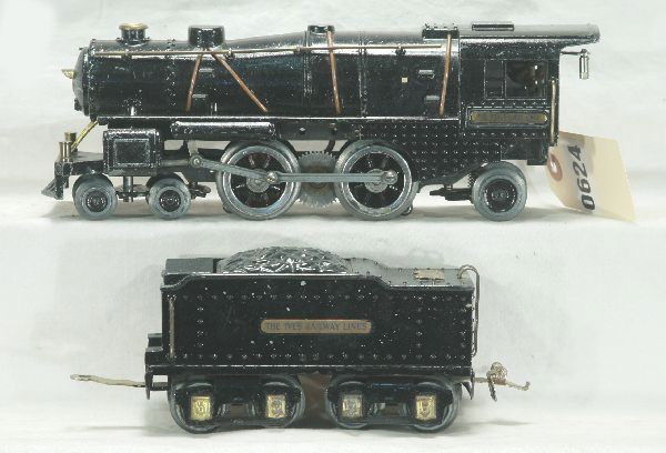 Ives 1122 Steam Loco, O-gauge: Nice boiler casting-has been clear coated, orig. wheels have black painted aftermarket accents, rods appear orig., motor runs fine, die cast tender matches tender w/ same clear coat, has moderate play