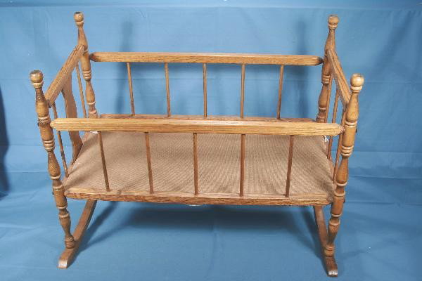 3 Pc. Doll/Childs Furniture: Oak Cradle, 27 X 21 X 20", Excellent; Childs Chair, painted gloss white, minor age crack on 1 bolster underneath, otherwise Excellent; Dark stained High Chair, 26" Tall in Very Good Condition. Large b