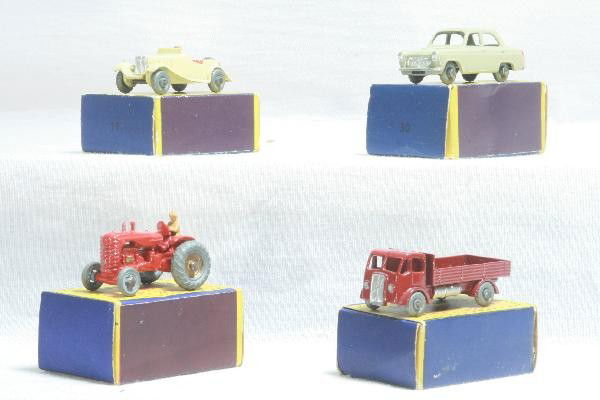 4 Boxed Early Matchbox Vehicles: Model 4 shows light playwear with a bend to exhaust stack, Models 19, 20 & 30 are like new with minor axel oxi on 20, all Metal Wheelss, Moko Lesney obs, show light wear. For Bigger and Better photos