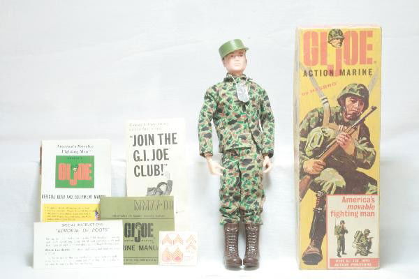 Early Boxed GI Joe Action Marine: Like New clean & complete with all paper work, original box shows edge wear. For Bigger and Better photos or information about consigning in our future events go to our website