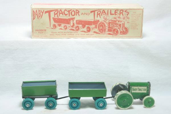Boxed Animate Toy Baby Tractor & Trailers Set: Shows light playwear, 9 1/2" Long, includes tipple trailer & open trailer, band drive not working, includes traction bands in envelope, nice original box. For Bigger and Better photos or information a