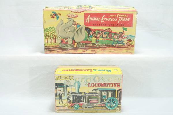 Two Boxed Battery Op Train toys: Scarce SAN Animal Express with smoke, mechanism needs TLC, tin litho shows only light play wear; Factory New TM Bubble Locomotive, factory packed, functional, obs show some wear with inserts. For Bigg