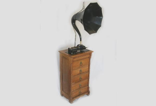Scarce Thomas Edison Victrola: Model H2957 latest patent date 1891. Overall height 67", factory mounted on oak cylinder cabinet with dimensions of 18 1/2 X 15 X 34 1/2", original brass pulls & key. Mechanism functional. Top has wat