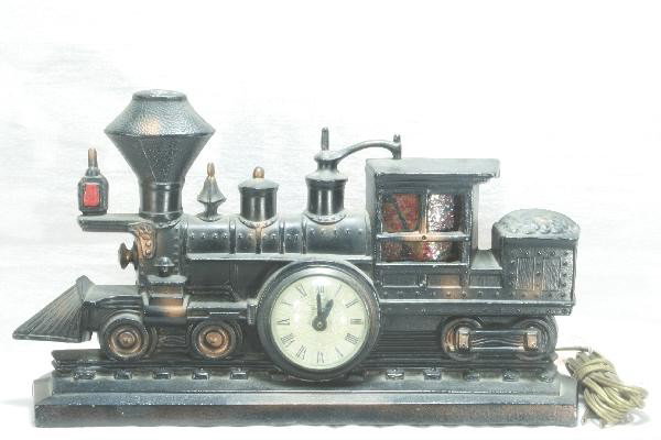 United Steam Locomotive Clock: Cast case, 14" Long, lighted cab. Clocks, Radios and other electrical devices are being sold as untested, as-is. If you would like an item tested, assuming, if electrical, the cord is safe, we will at